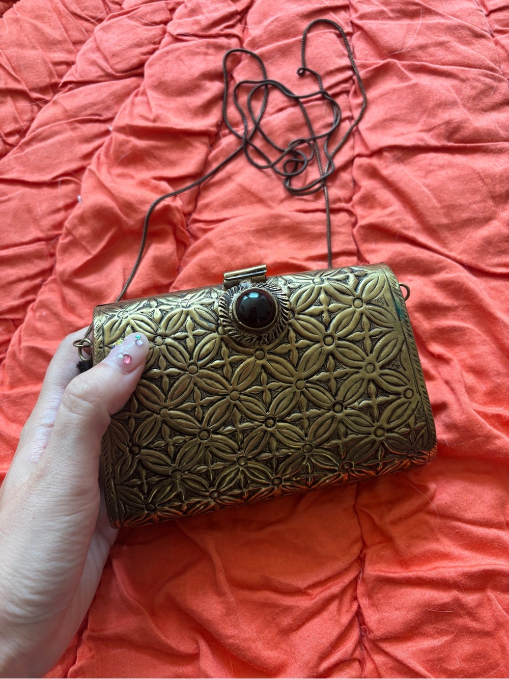 From St. Xavier Floral Metal Clutch in Bronze with Decorative Stone Accent